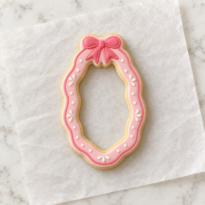 Anniversary Oval Bow Frame Cookie Cutter (decorated cookie mockup)