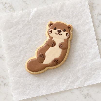 Baby Otter Outline Cookie Cutter (decorated cookie mockup)