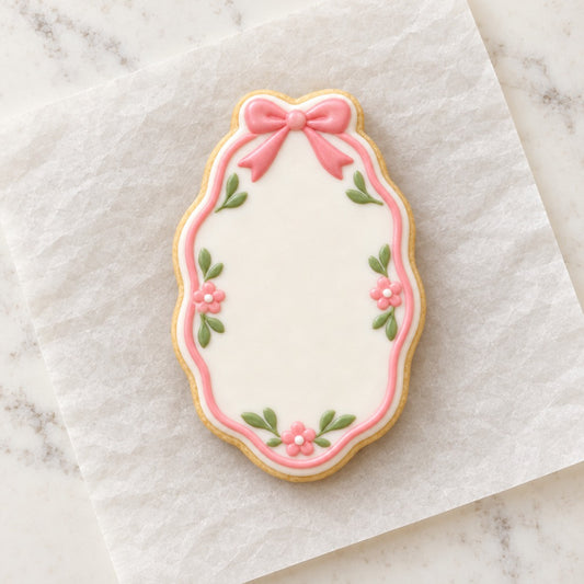 Oval Bow Frame Cookie Cutter (decorated cookie mockup)